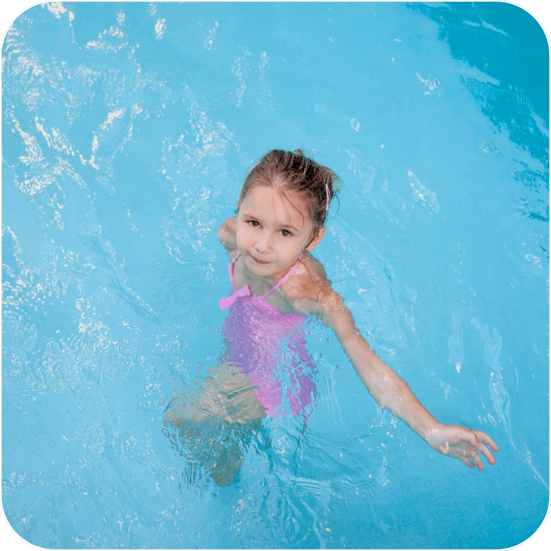 Girl swimming in a pool.