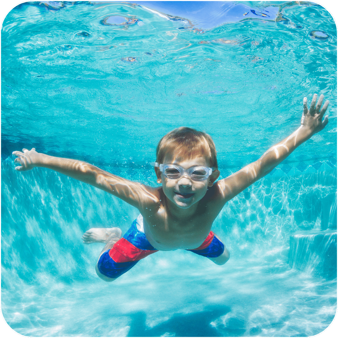 A kid swimming under water.