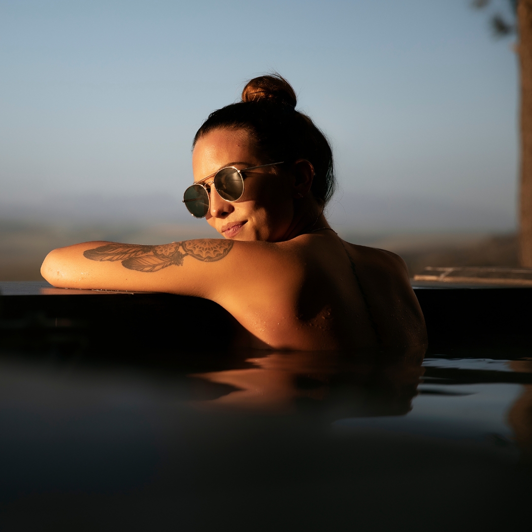 Woman relaxing in a hot tub