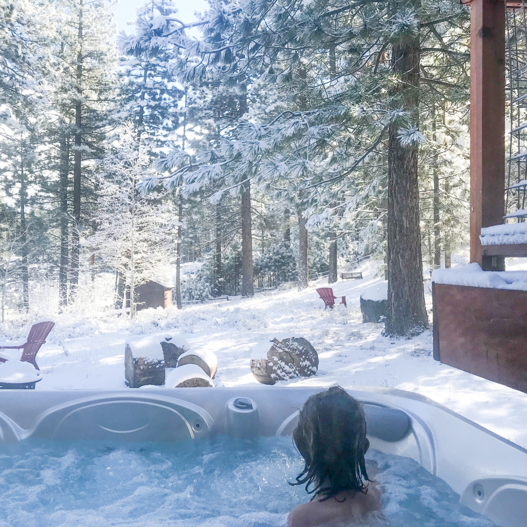 woman enjoying a hot tub outdoors