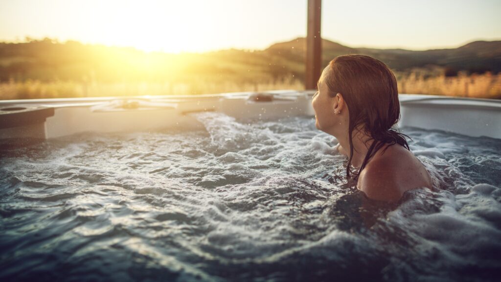 Woman relaxing in a swim spa